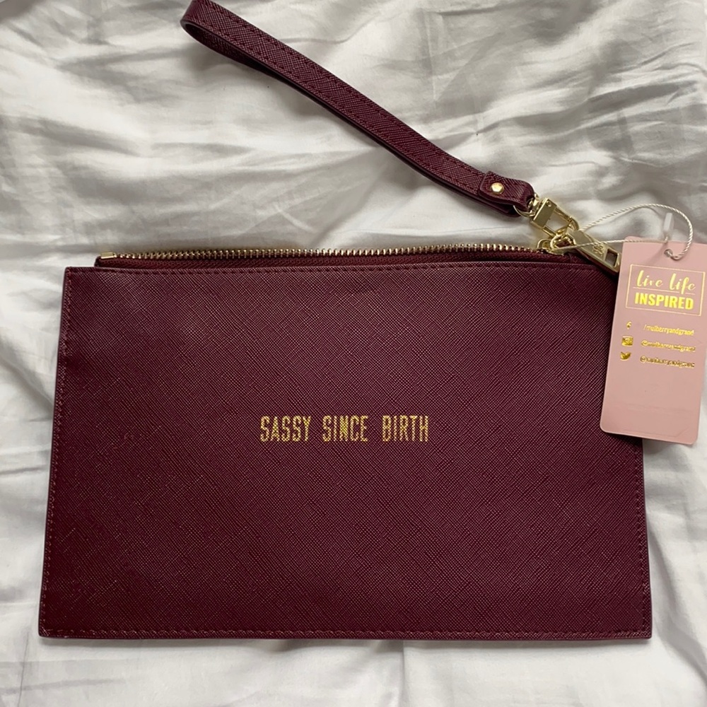 “Sassy since birth” clutch